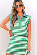 A woman wearing a sleeveless striped knit quarter-zip top and matching mini skort, available in green, white, and blue.