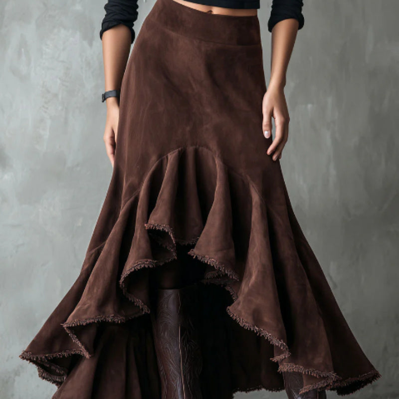 A stylish brown high-low maxi skirt featuring ruffle details and soft eco-suede fabric.