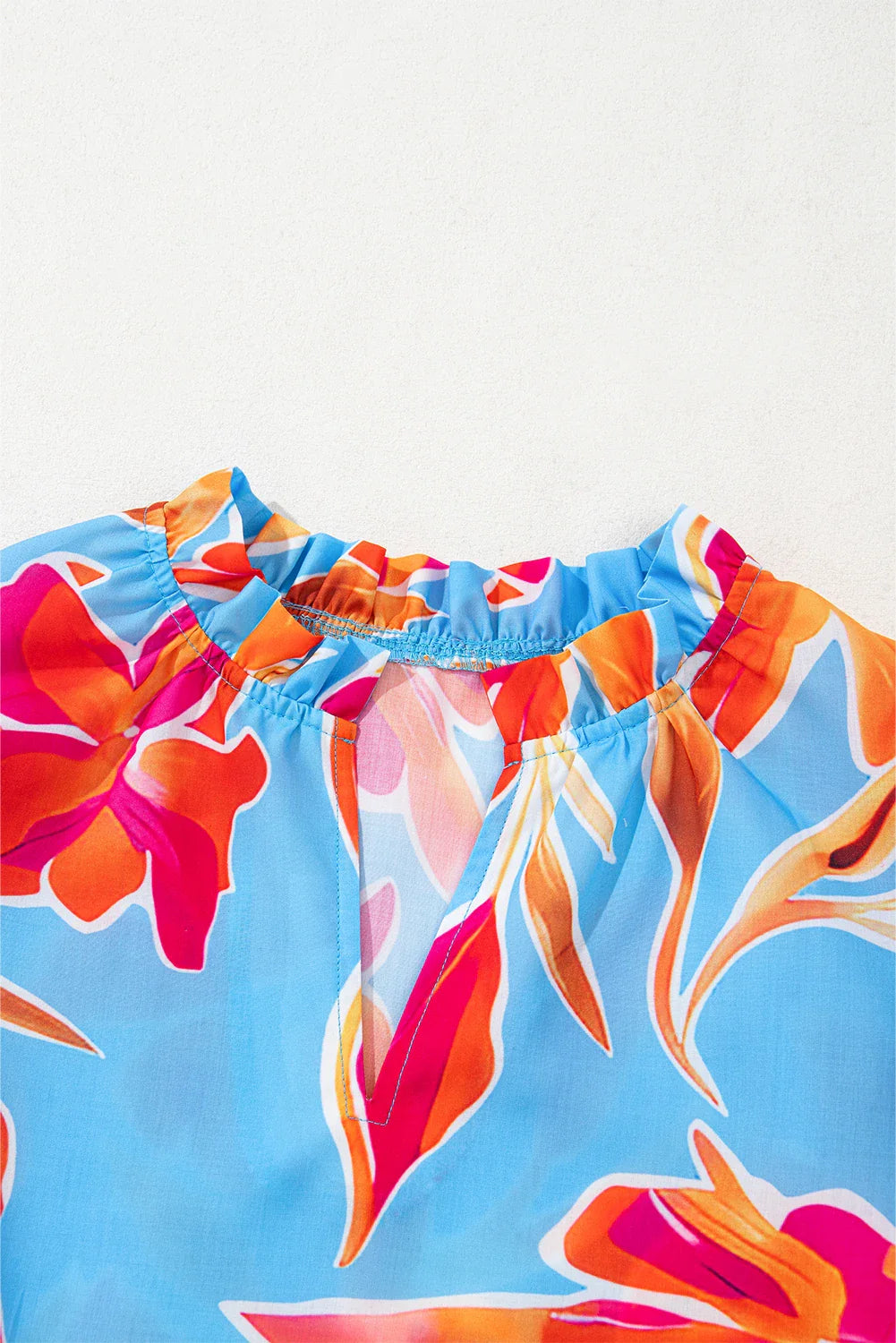 Floral V-Neck Flutter Sleeve Blouse in Sky Blue