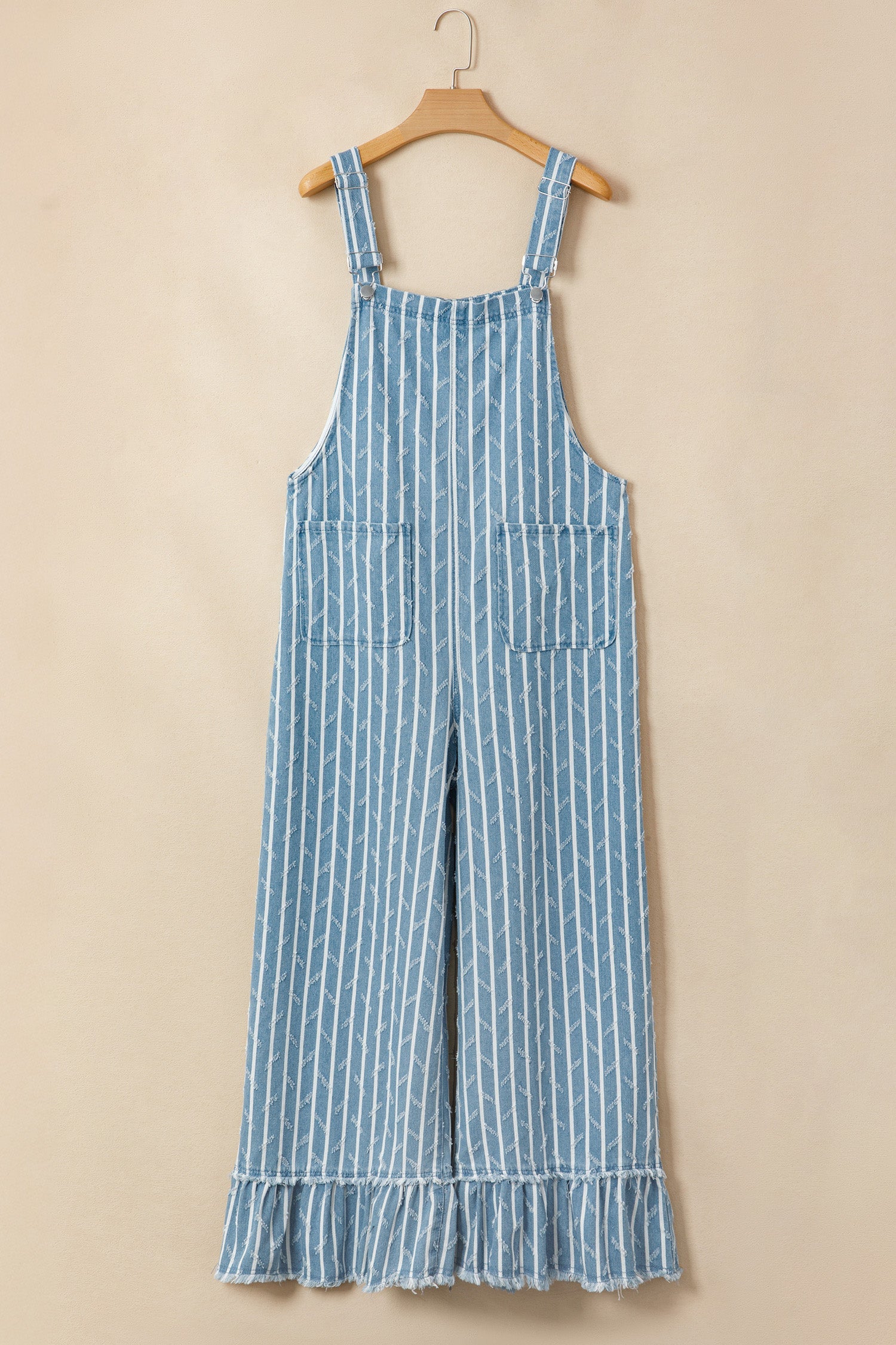 Blue and white striped denim overalls with a wide-leg fit and ruffled hem details.