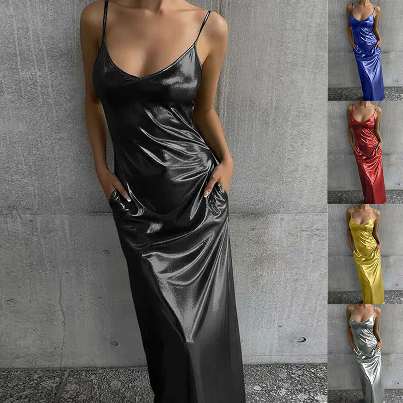 Model wearing a red textured mirror-finish maxi slip dress with pockets