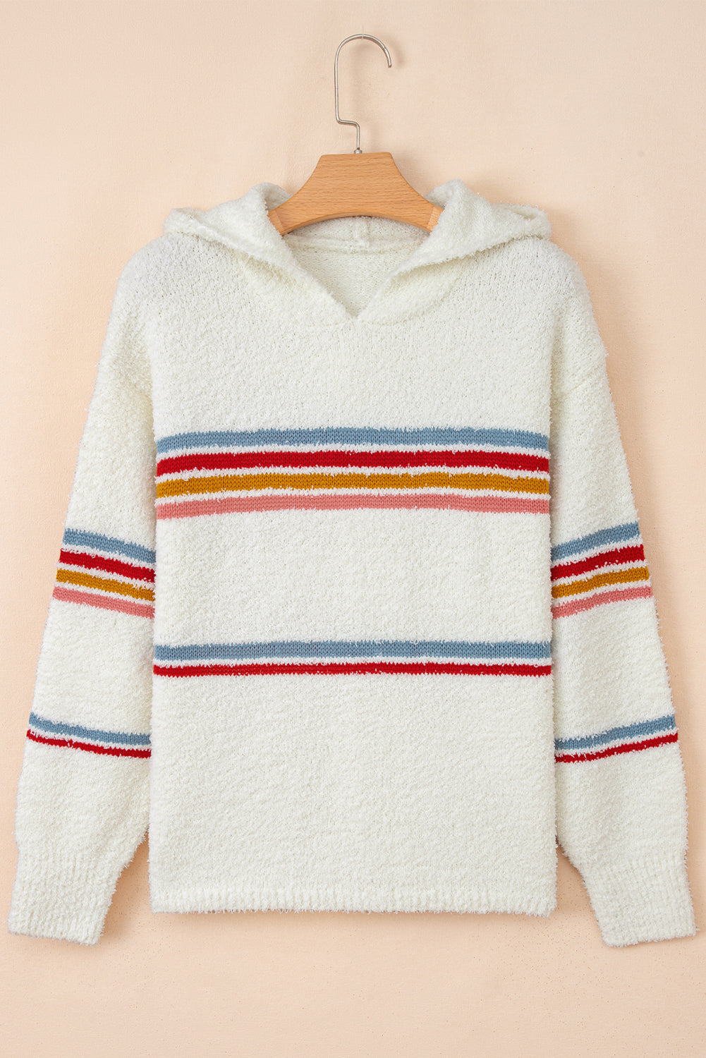 White popcorn knit sweater with horizontal red, yellow, and blue stripes and an attached hood
