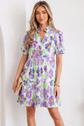 Close up of Penelope Tiered Ruffle Mini Dress featuring V-neck collar and floral pattern