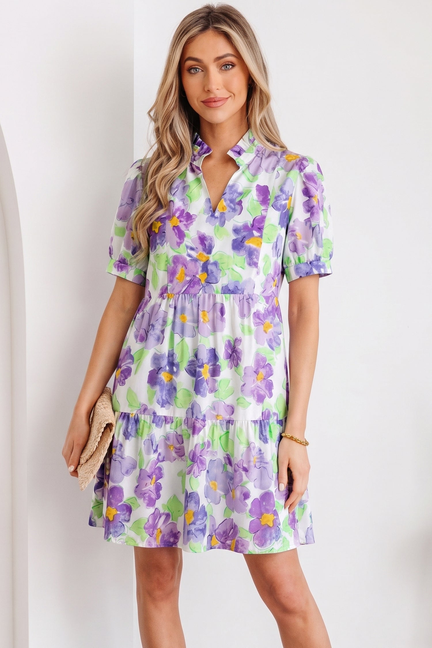 Close up of Penelope Tiered Ruffle Mini Dress featuring V-neck collar and floral pattern