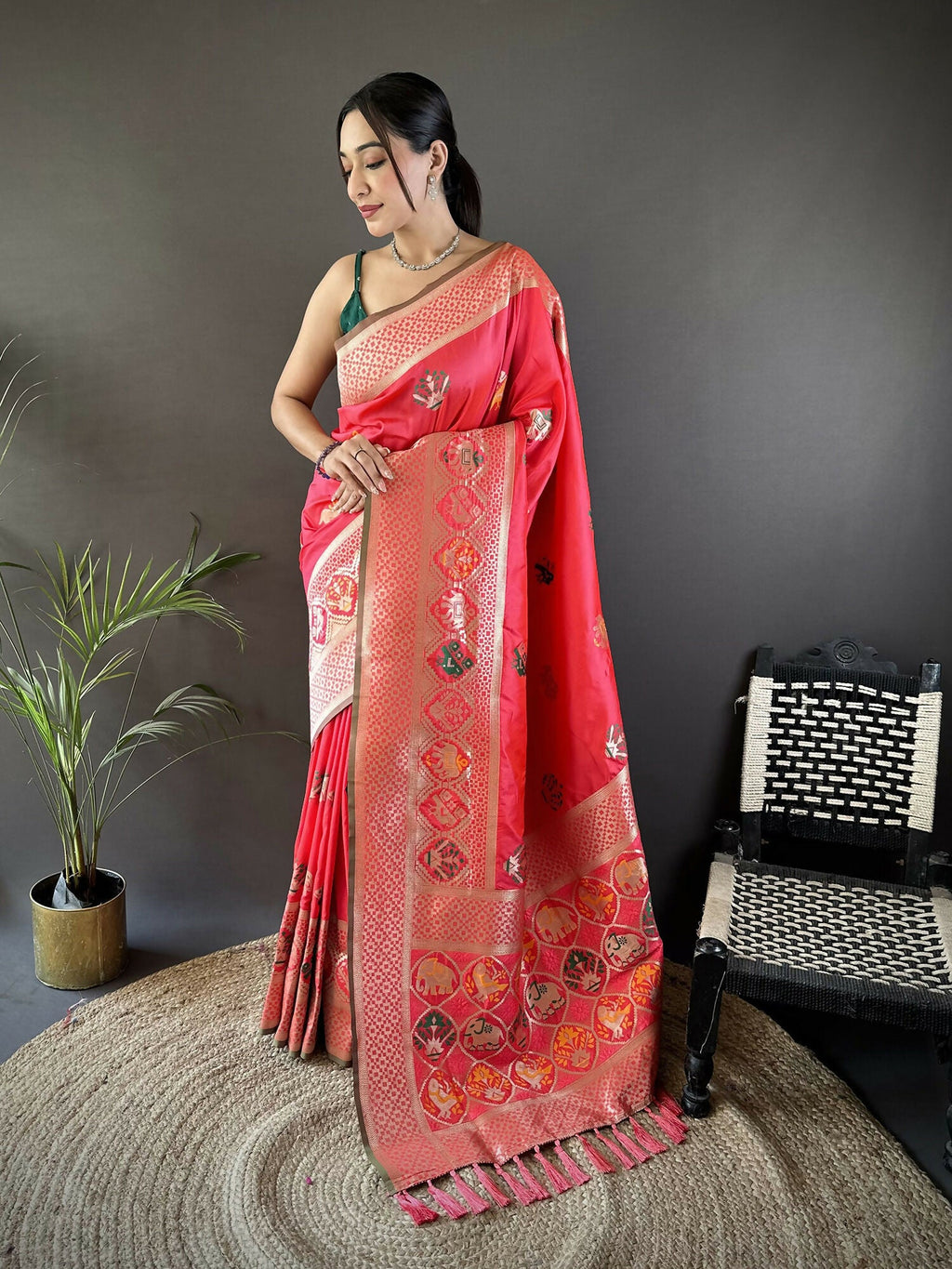 Peach Soft Lichi Silk Banarasi Saree with elephant and floral motifs paired with a green blouse