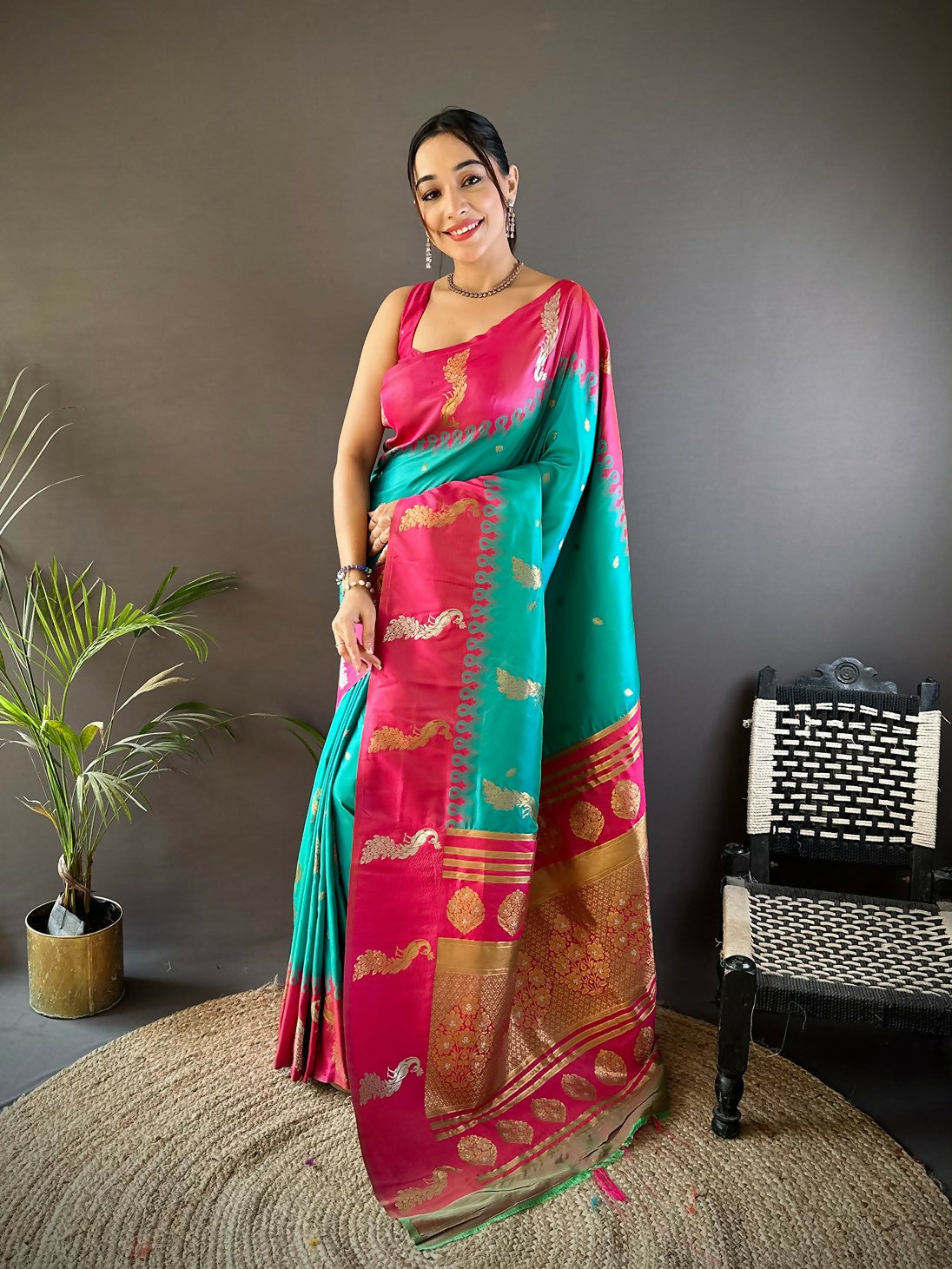 Pink Banarasi silk saree with gold peacock and butti motifs, includes unstitched blouse fabric.