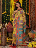 A beautiful yellow linen cotton saree with matching blouse piece draped elegantly.