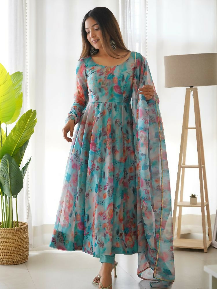 Light sky blue organza kurta set featuring sequin embroidery details and matching cotton trousers.