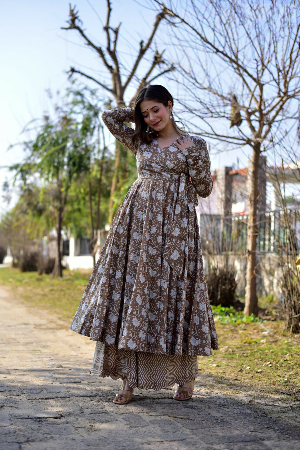 Coffee colored cotton silk kurta paired with a wide flair digital printed palazzo