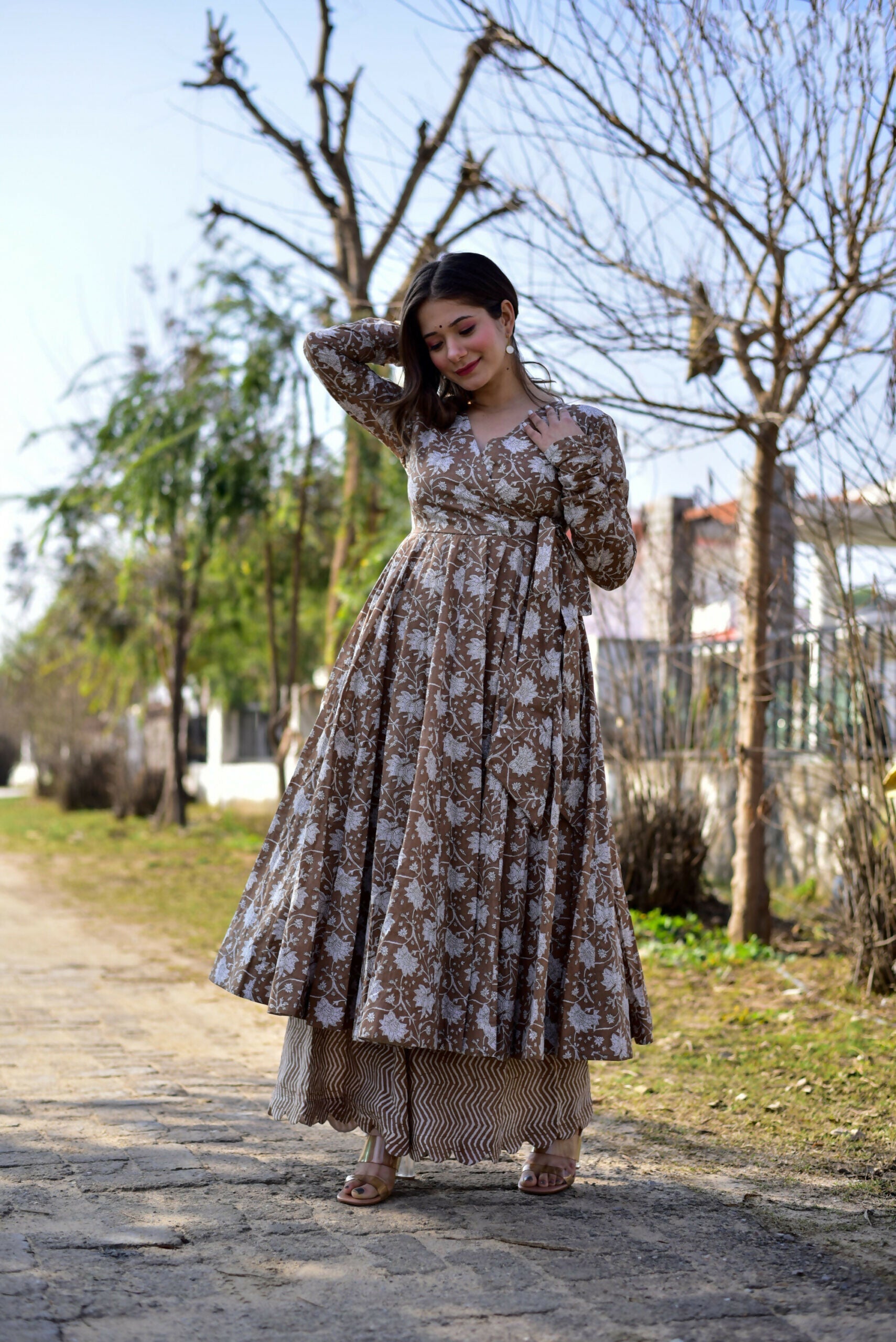 Coffee colored cotton silk kurta paired with a wide flair digital printed palazzo