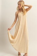 Beige and cream knotted halter neck maxi dress with a flowy, elegant silhouette