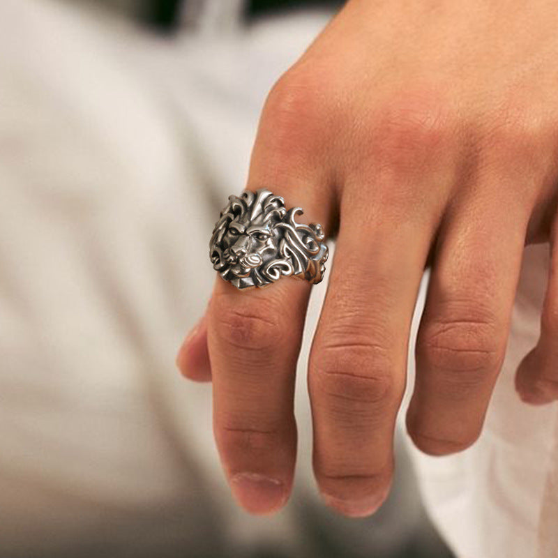 Detailed mens lion motif ring with a silver-plated finish and adjustable band.
