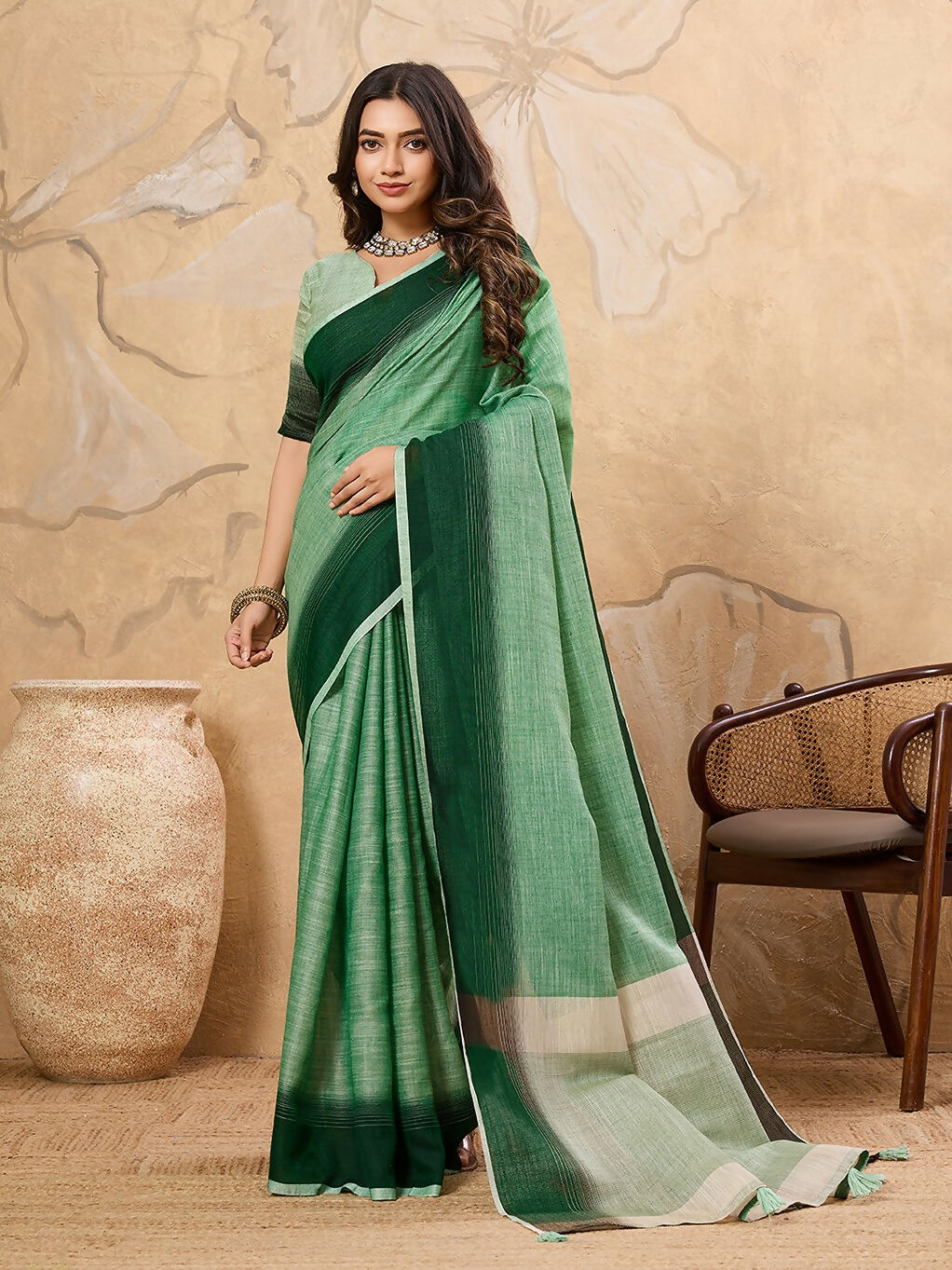 Pista green linen saree with matching blouse piece draped elegantly