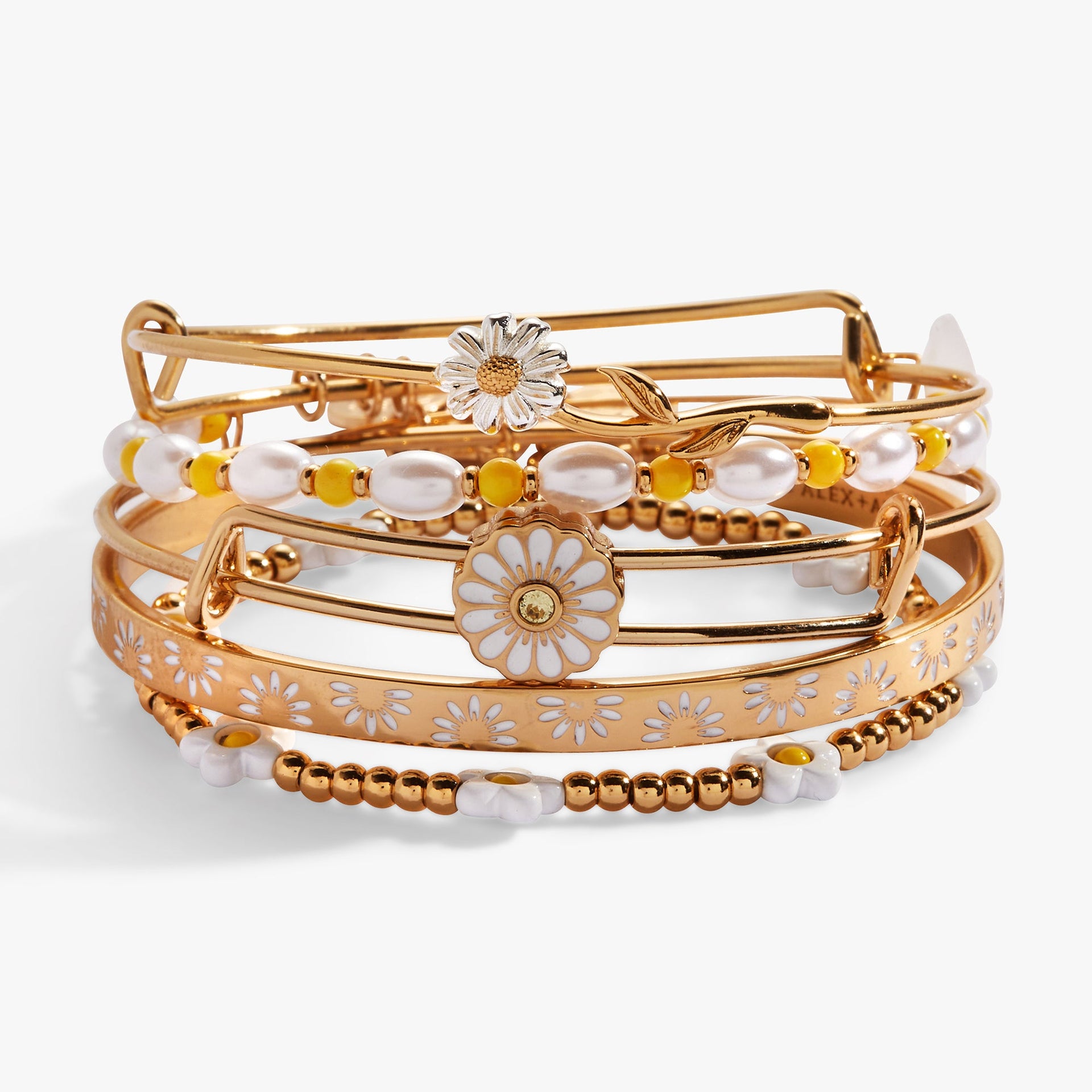 Set of five gold-toned bohemian bangles featuring daisy flower charms, beads, and floral patterns.