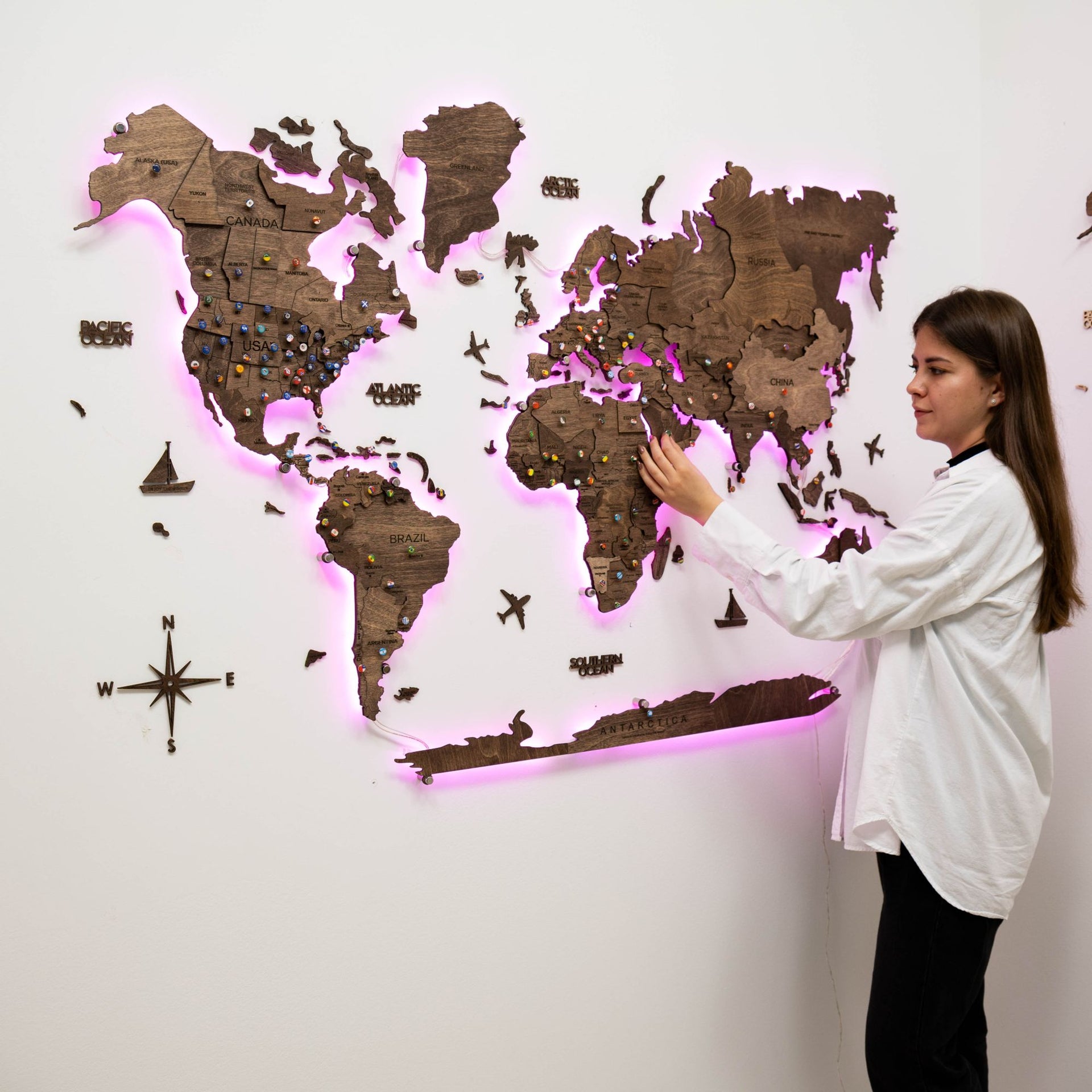 3D wooden world map in dark walnut finish with interactive LED backlight
