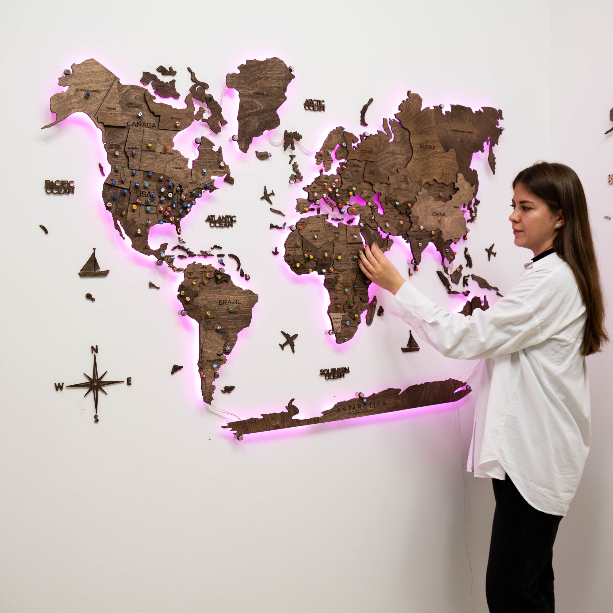 3D wooden world map in dark walnut finish with interactive LED backlight