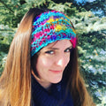 A chunky, hand-knit ear warmer headband made from textured recycled silk yarn.