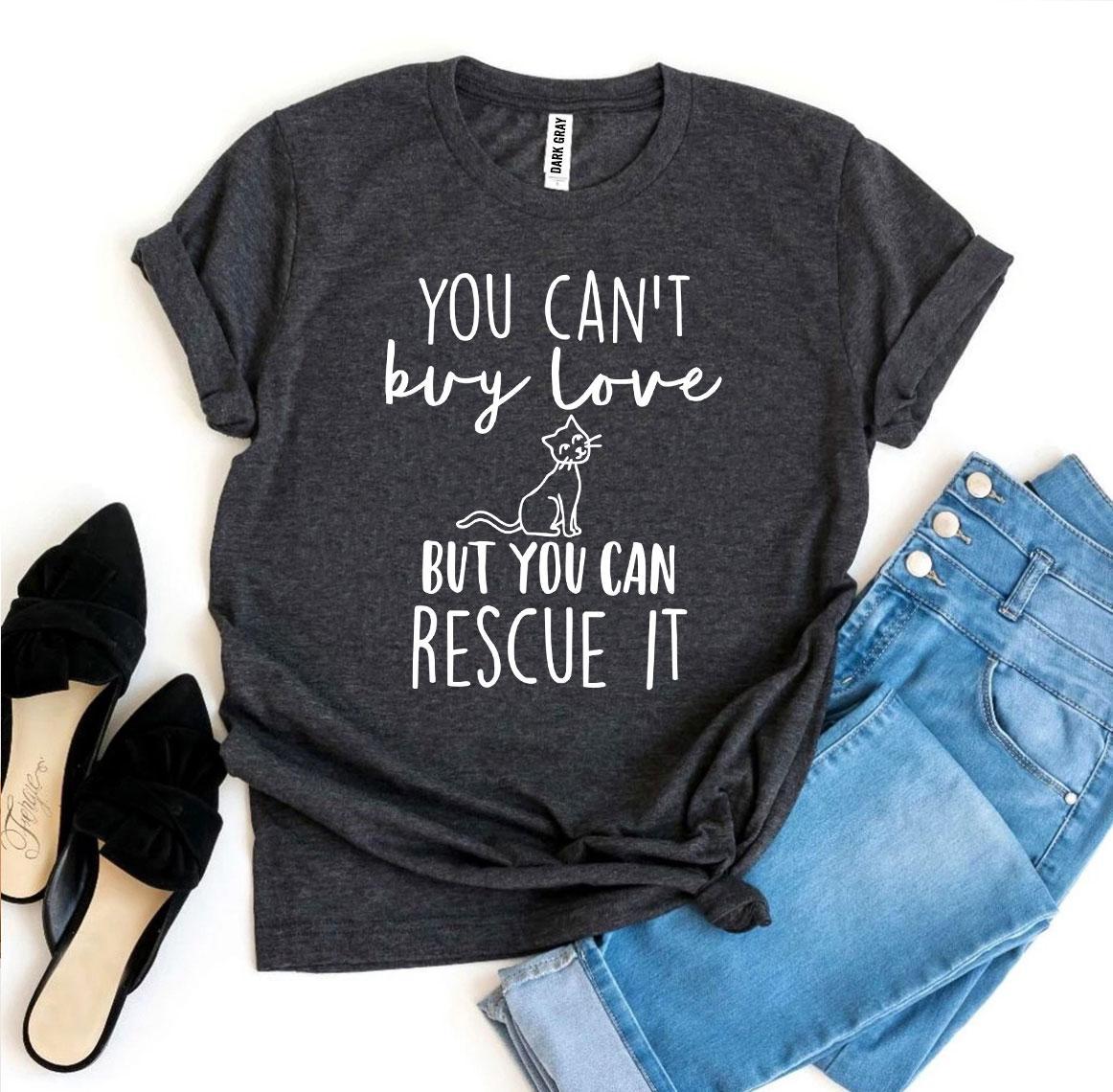 A heather grey and a dark grey t-shirt with the text 'You Can't Buy Love But You Can Rescue It' featuring a cat illustration