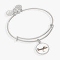 An expandable wire charm bangle with an engraved 'Daughter' charm and a small clear crystal accent in silver and gold.