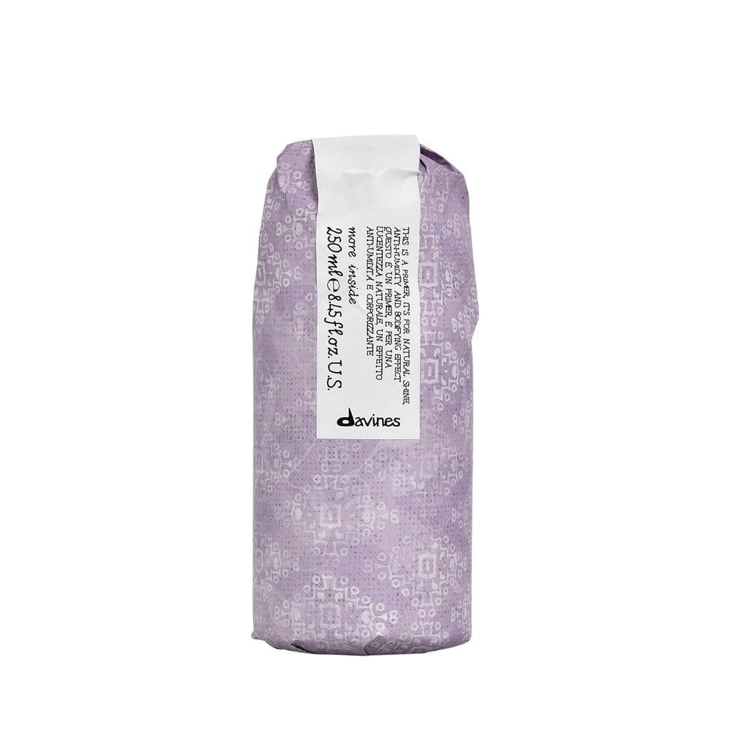 A 250 mL bottle of Davines This is a Blow Dry Primer, a professional-grade heat protection styling spray for hair.