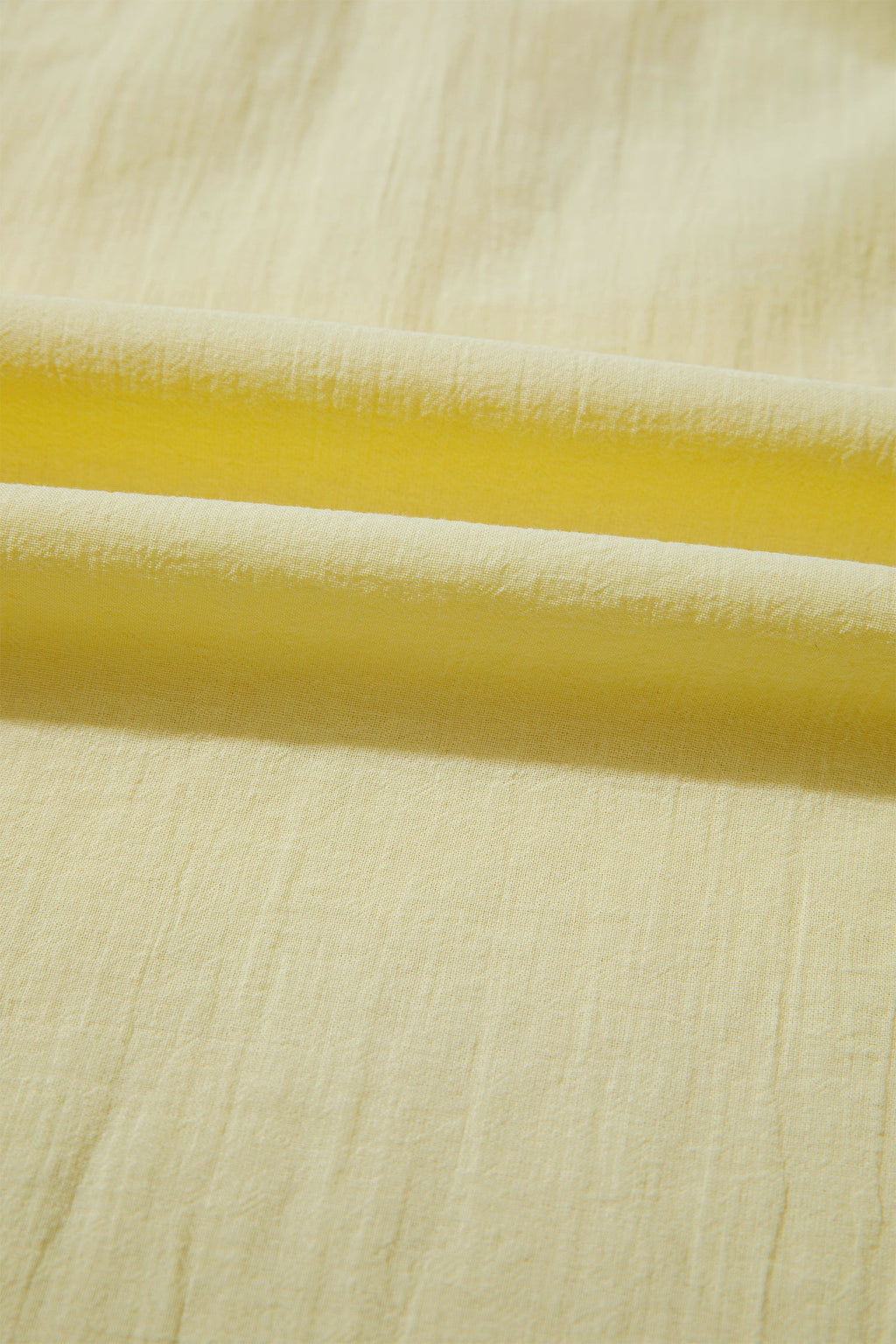 Solid V-Neck Sleeveless Top with Ruffle Trim in Yellow