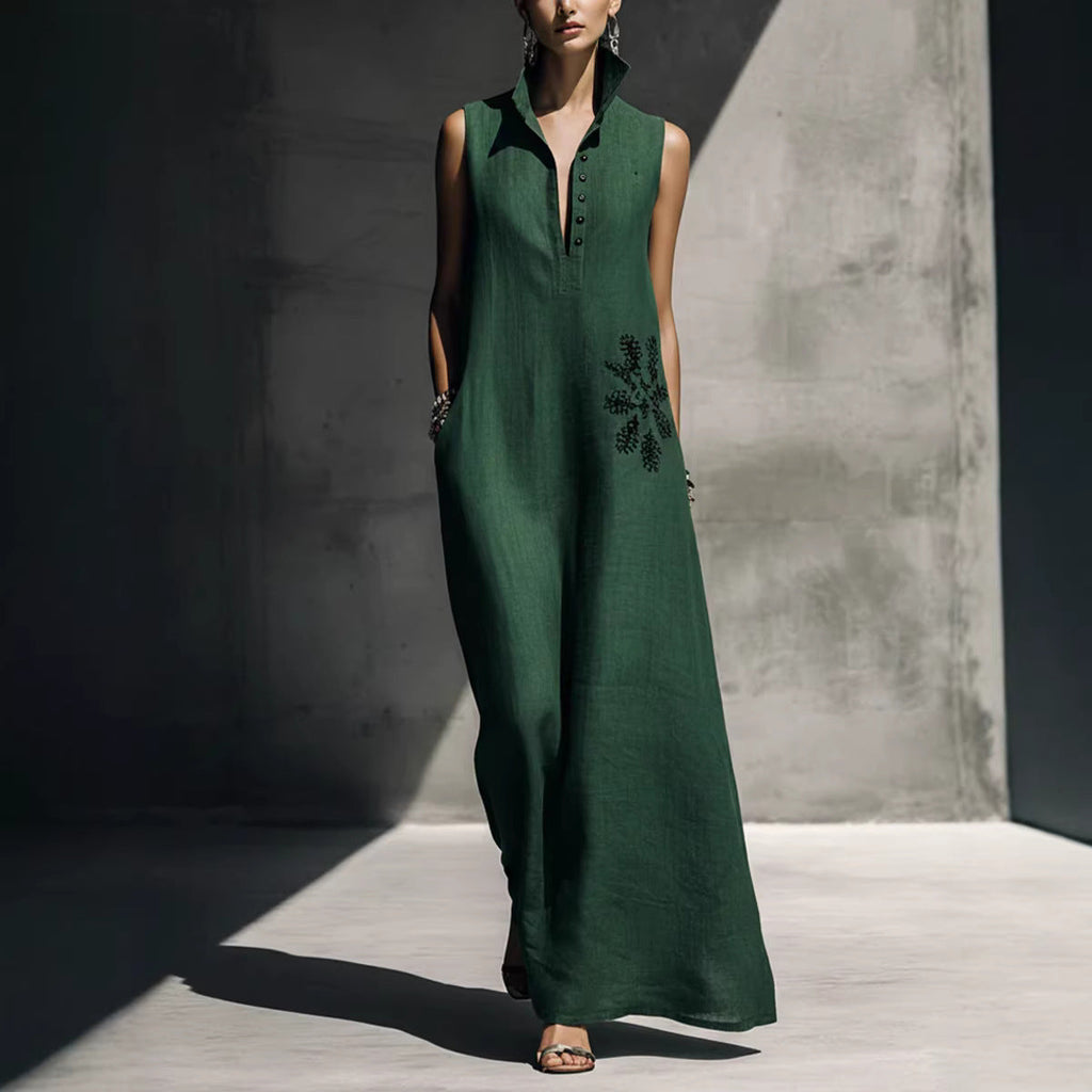 Model wearing a sleeveless cotton linen maxi dress with a mandarin collar and graphic print in deep green or white.