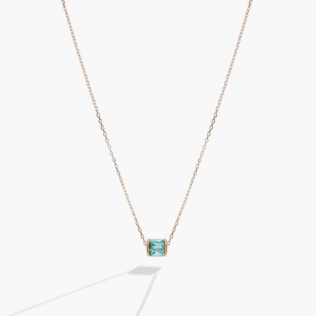 Alex And Ani December birthstone pendant necklace featuring blue baguette crystals in a sterling silver or gold vermeil barrel charm.