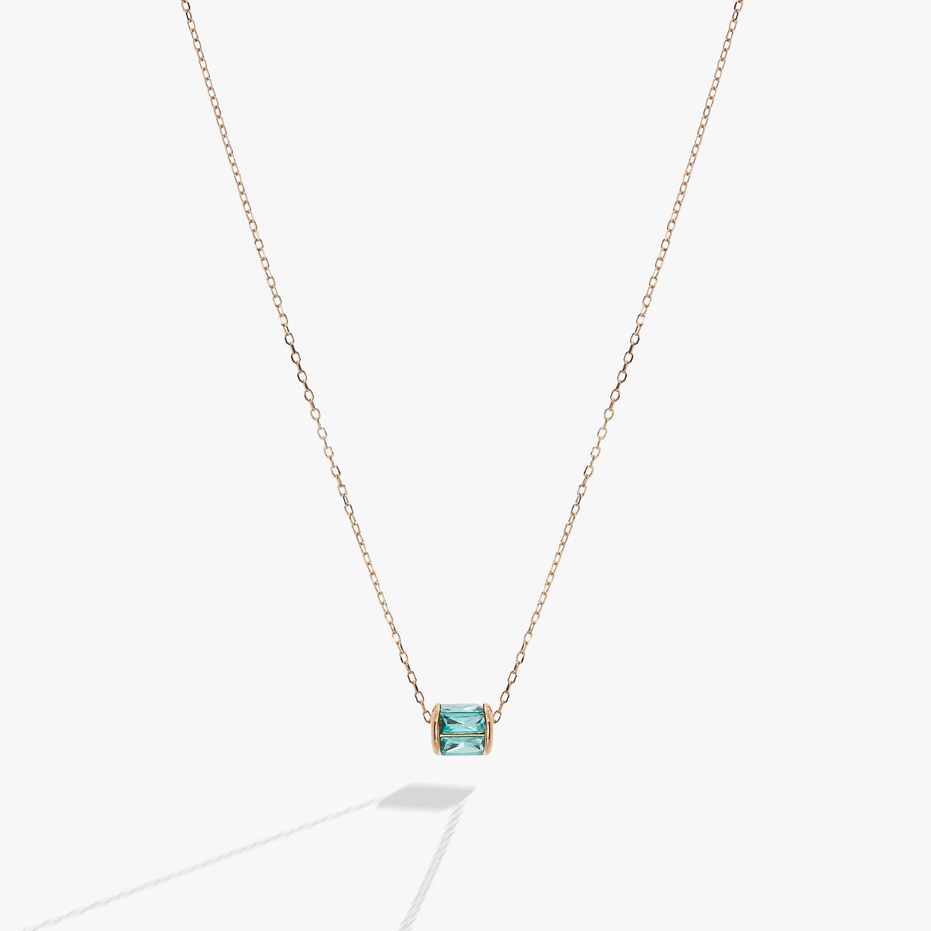 Alex And Ani December birthstone pendant necklace featuring blue baguette crystals in a sterling silver or gold vermeil barrel charm.