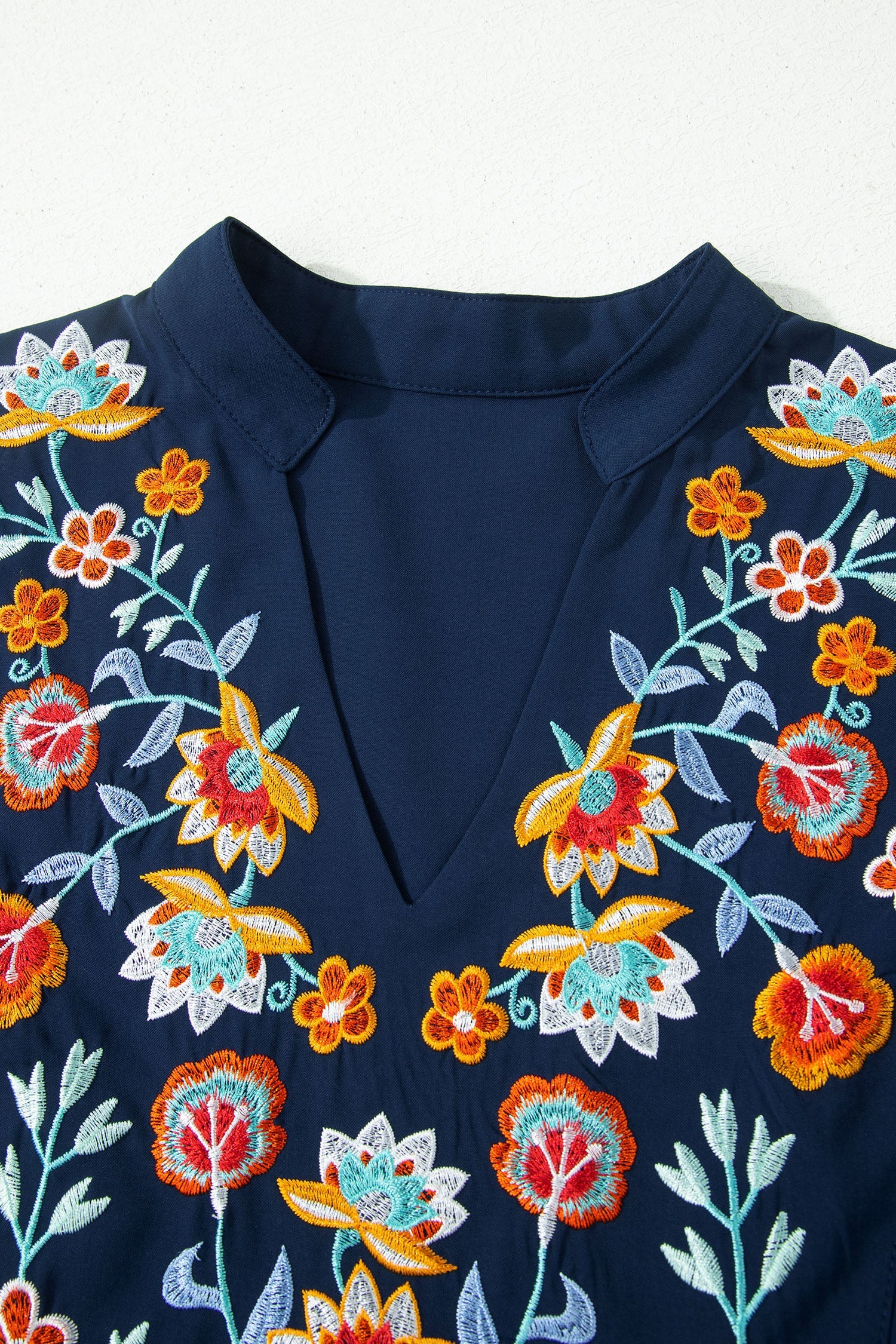 Embroidered Babydoll Blouse with Notched Neck and Ruffle Sleeves
