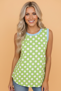A loose-fitting polka dot sleeveless tank top with bold contrast trim on the neckline and armholes.