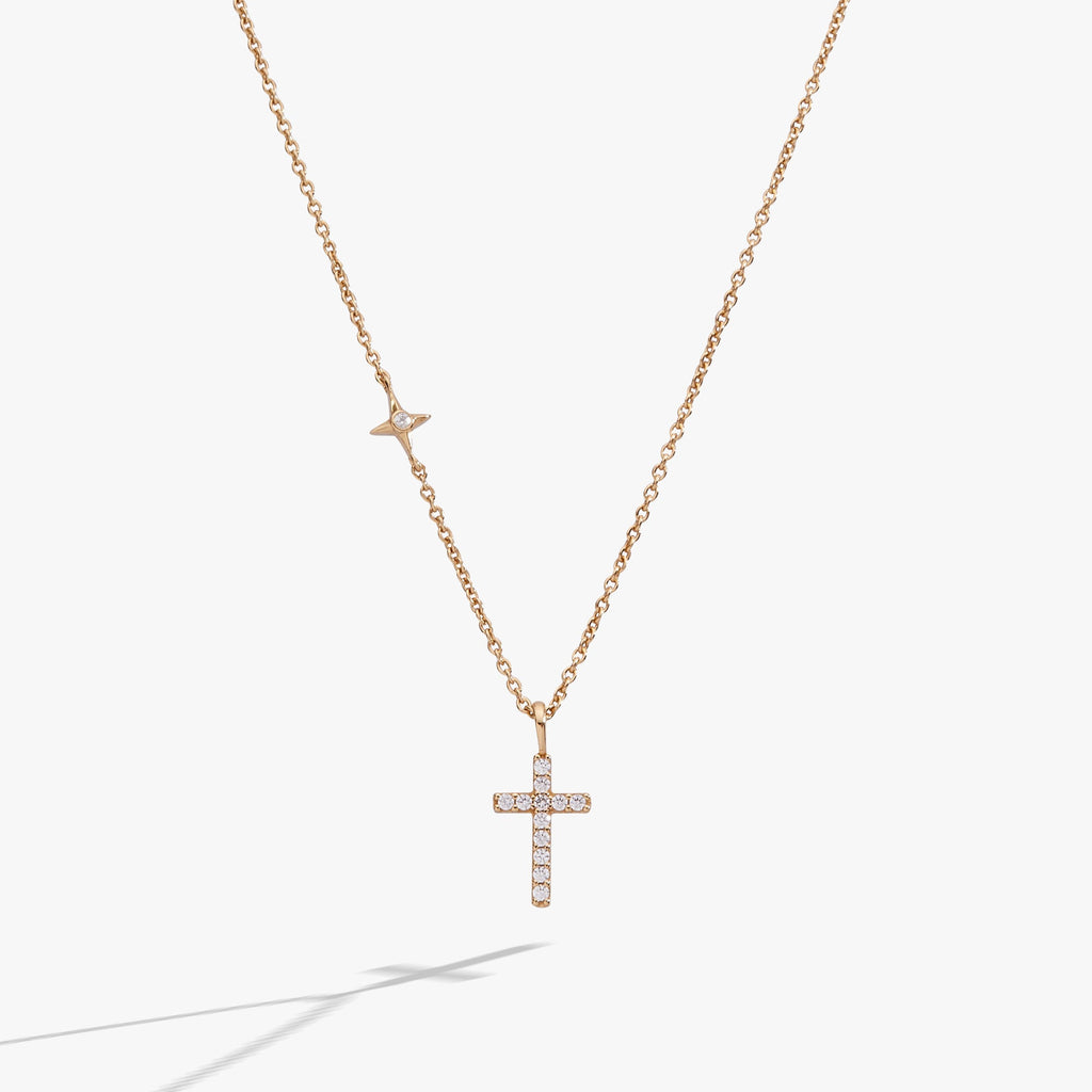Gold-plated sterling silver delicate cross pendant necklace with pave crystals.