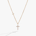 Gold-plated sterling silver delicate cross pendant necklace with pave crystals.