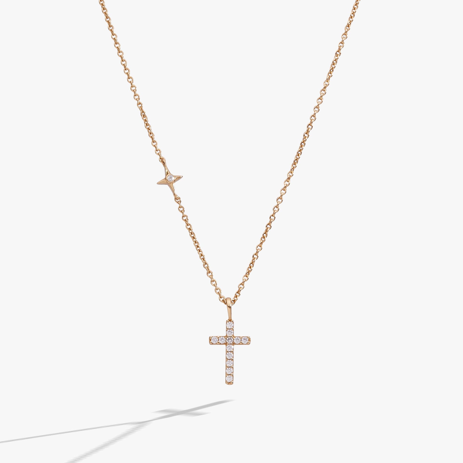Gold-plated sterling silver delicate cross pendant necklace with pave crystals.