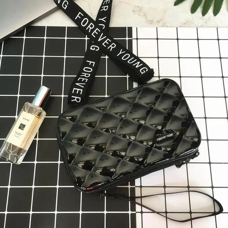 Small designer-style shoulder bag and clutch for girls made of soft PVC