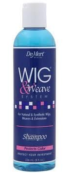 8 fl. oz. bottle of DeMert Wig and Weave Shampoo with translucent blue liquid and navy label.