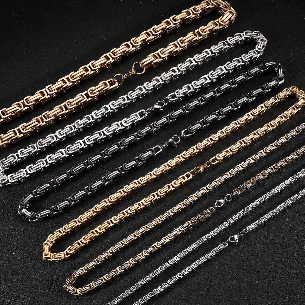 Men's polished stainless steel Cuban link bracelet in gold, silver, and black tones