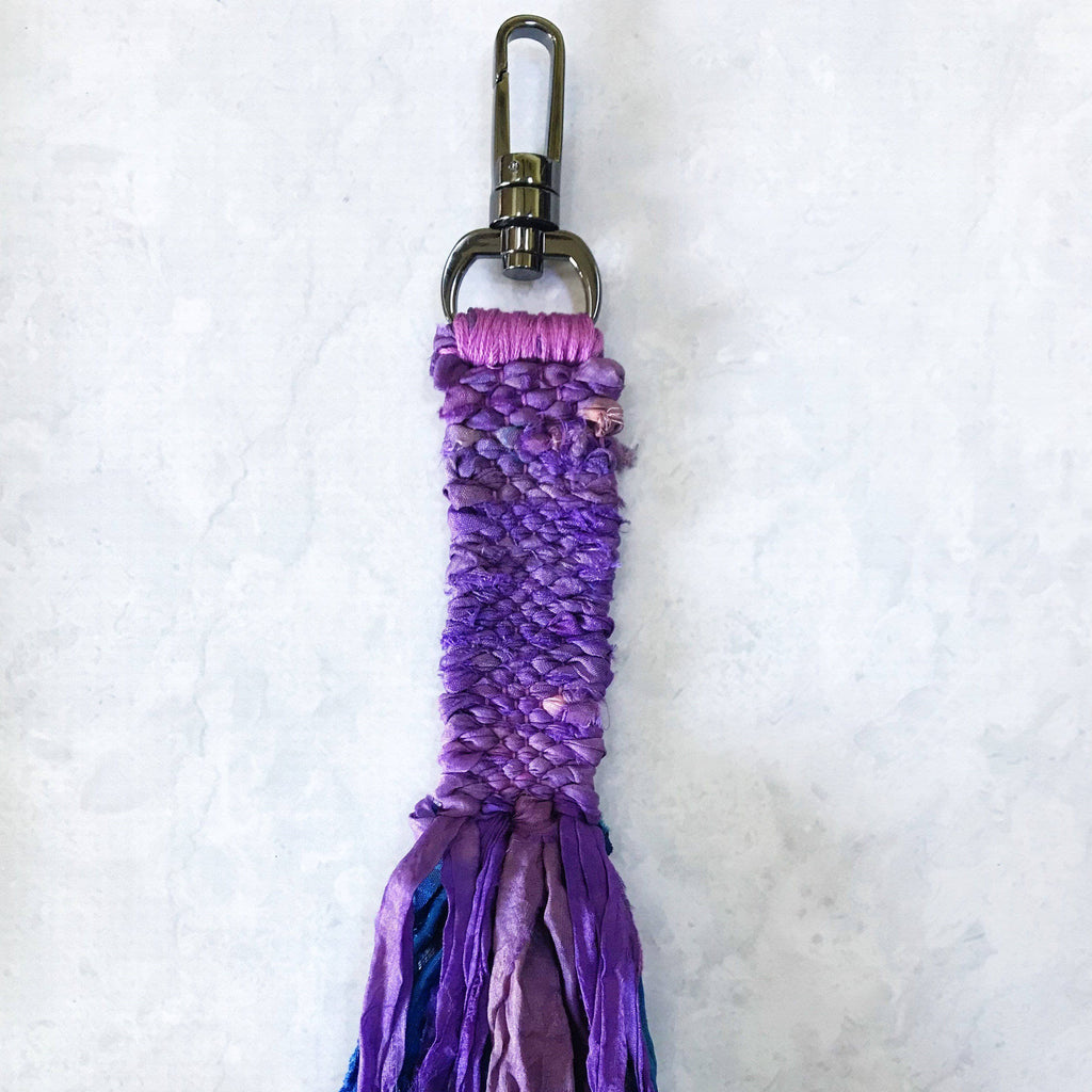DIY Woven Ribbon Keychain Kit featuring colorful yarn and materials to make a handmade woven keychain.