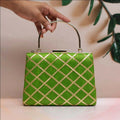 Green fabric clutch with intricate Gota Patti embroidery for ethnic occasions