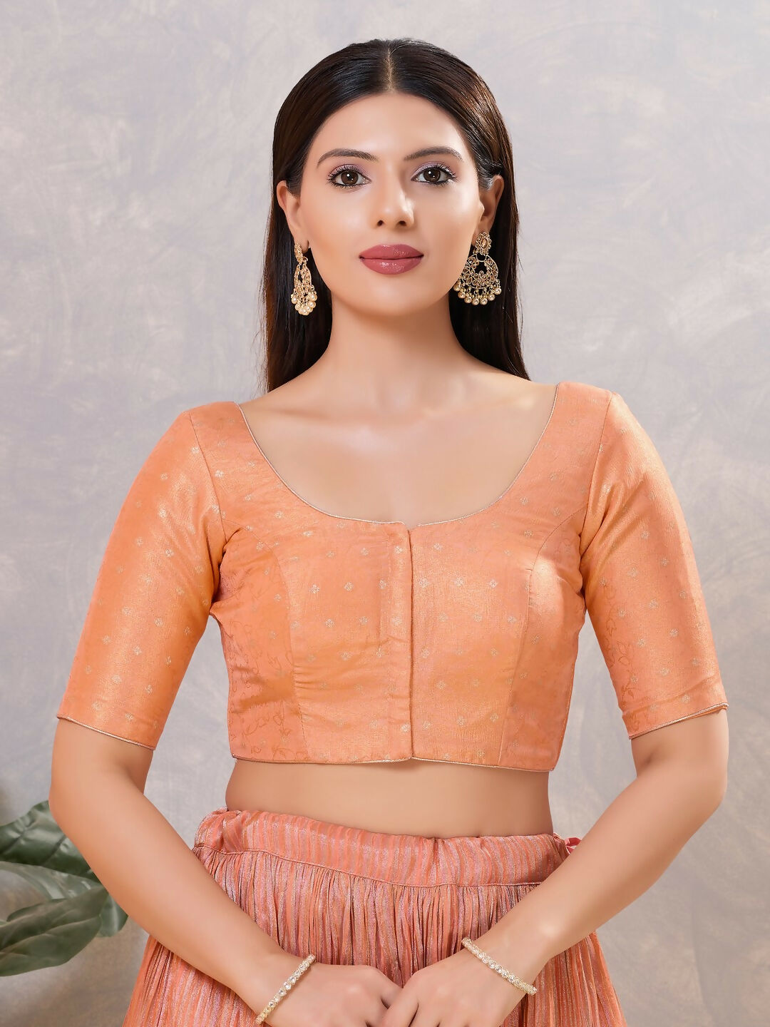 Peach silk stitched blouse with round neckline, solid design
