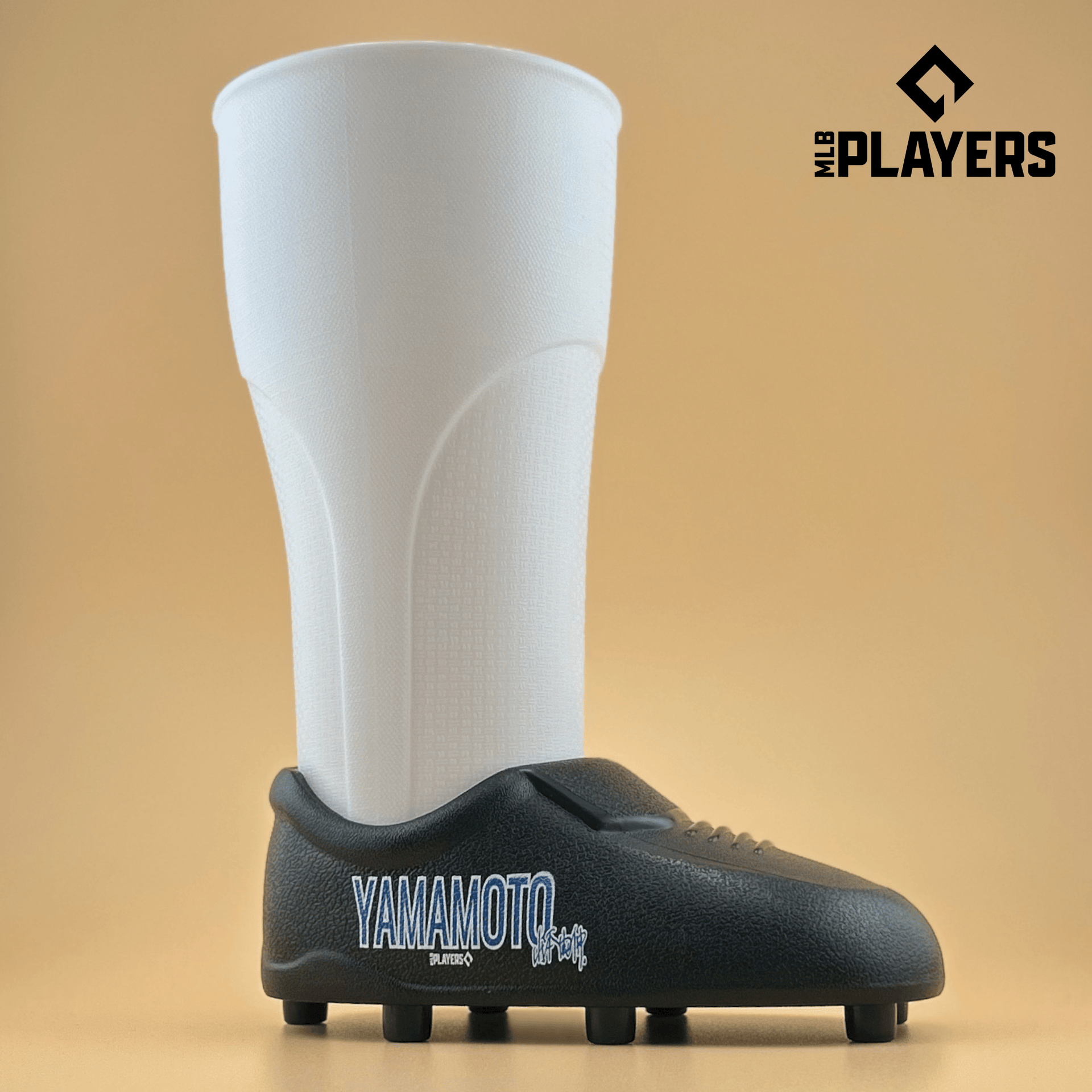 Yoshinobu Yamamoto themed cleat-shaped cup in white and black, 22oz capacity