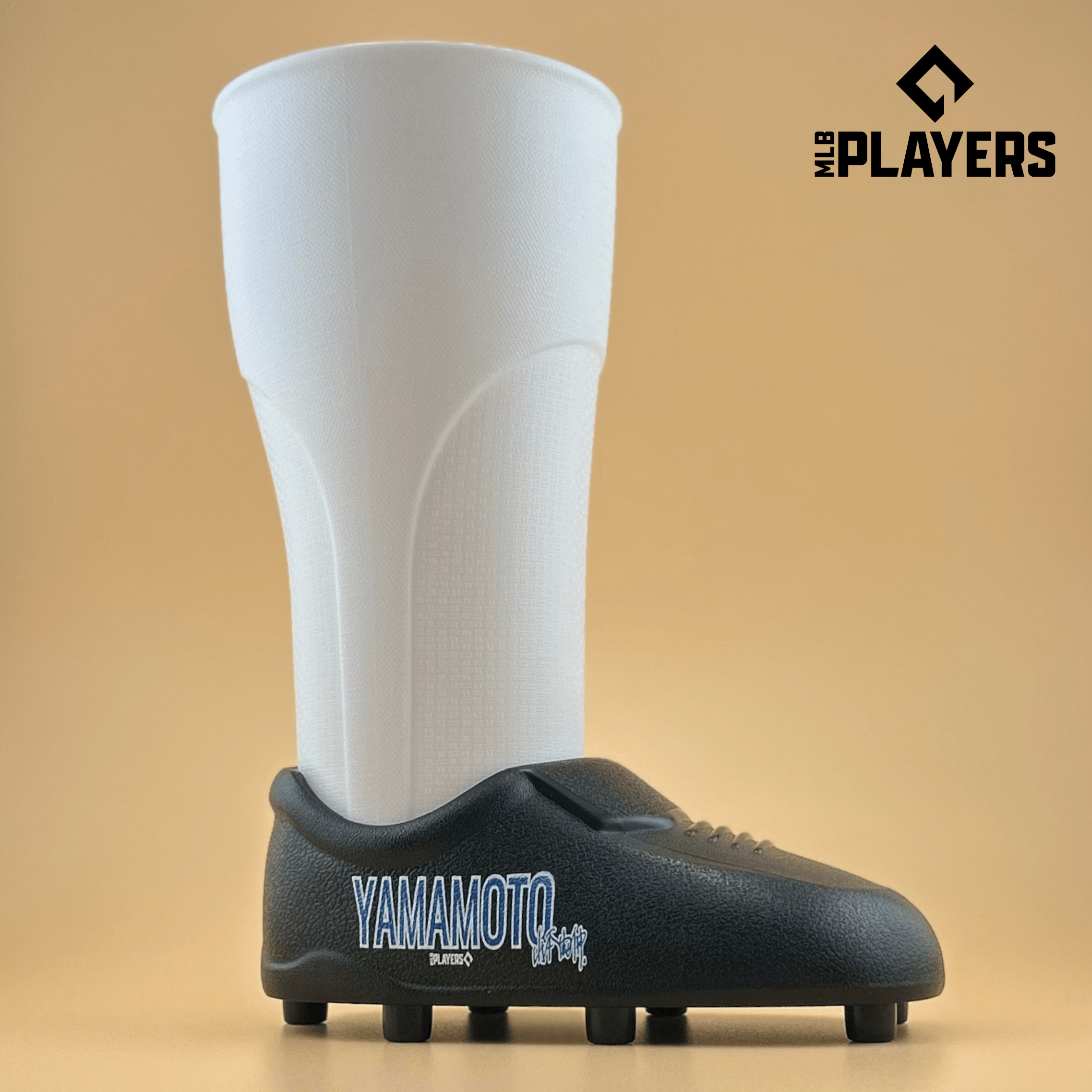 Yoshinobu Yamamoto themed cleat-shaped cup in white and black, 22oz capacity