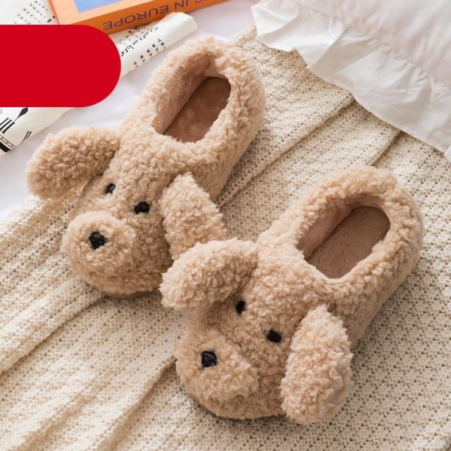 Cream and beige plush dog-themed house slippers for women on a soft surface.