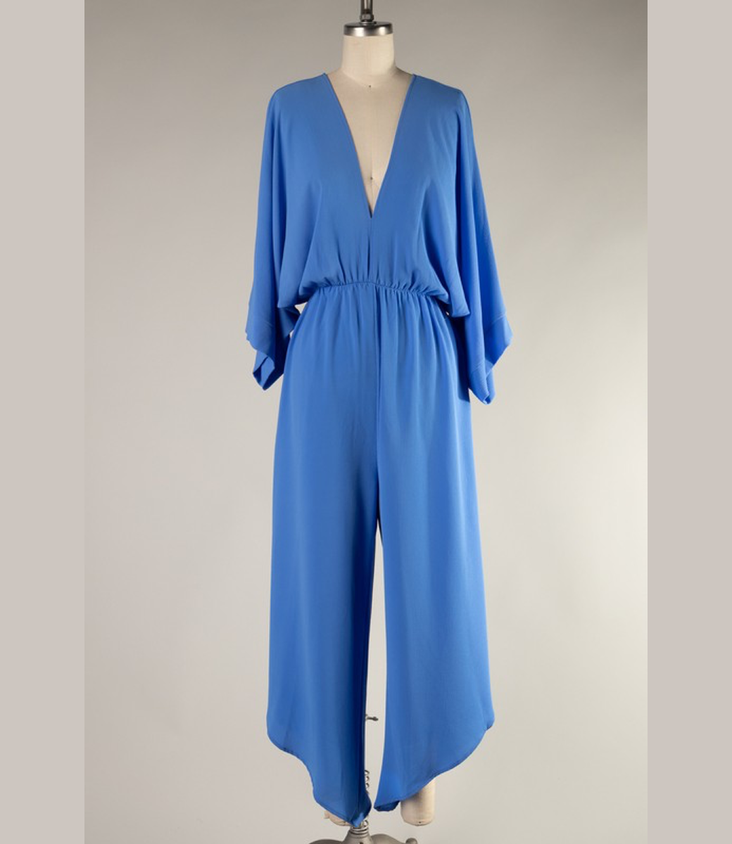 Model wearing a Clean Blue Dolman Capri Jumpsuit with relaxed sleeves and a flattering fit.