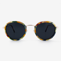 Dora round sunglasses with camo-patterned wood frame and slender metal temples.