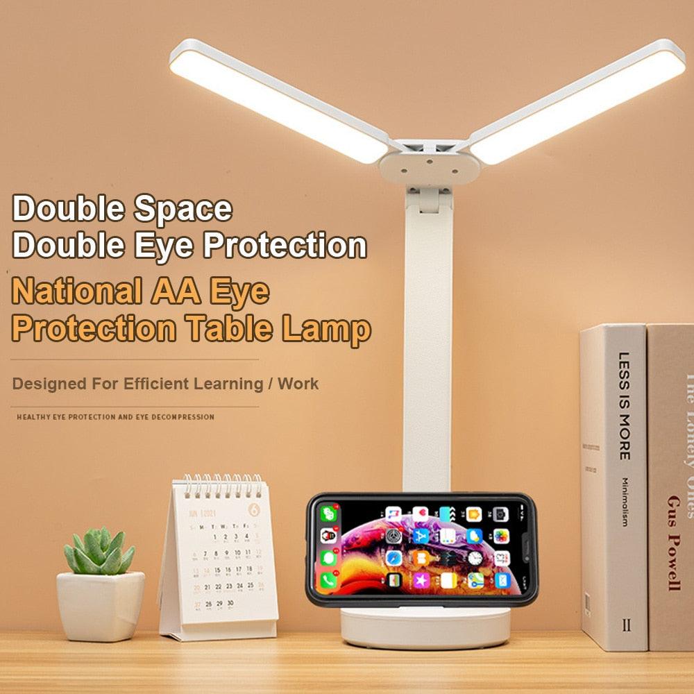 Modern white double-head LED desk lamp with smartphone holder
