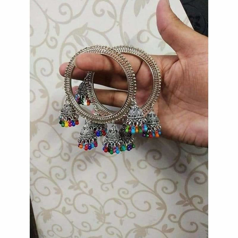 Silver bangle featuring hanging jhumki drops and colorful pearl accents