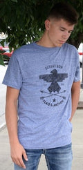 Men wearing a heathered blue Riser Crest short sleeve crew neck t-shirt with a distressed black graphic