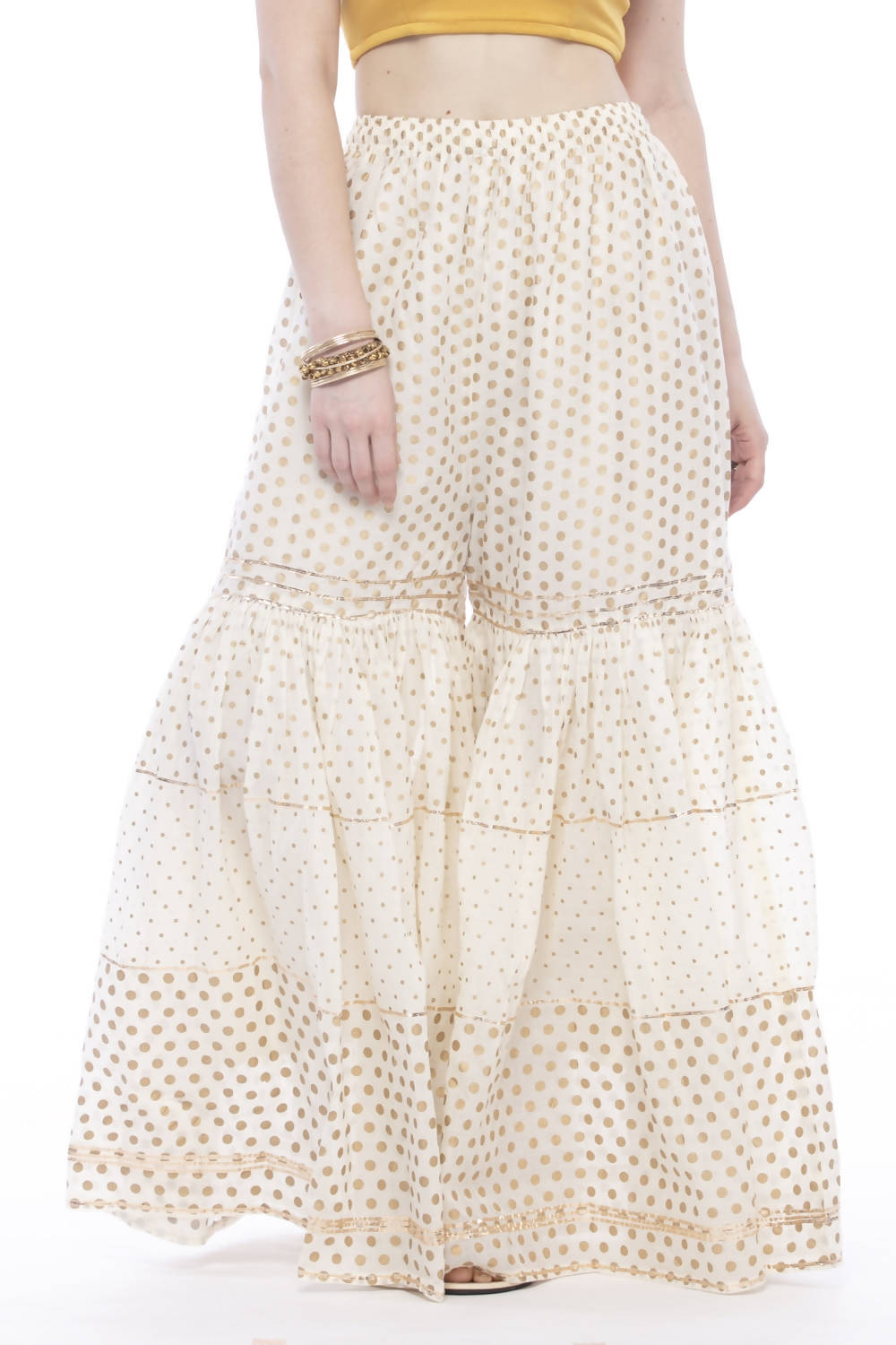 Off white cotton sharara pants with traditional gold print and gota embroidery detailing