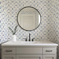 Dulcie blue and white patterned wallpaper in a coastal style bedroom setting.