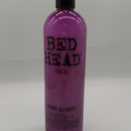 TIGI Bed Head Dumb Blonde Shampoo bottle for brightening blonde hair.